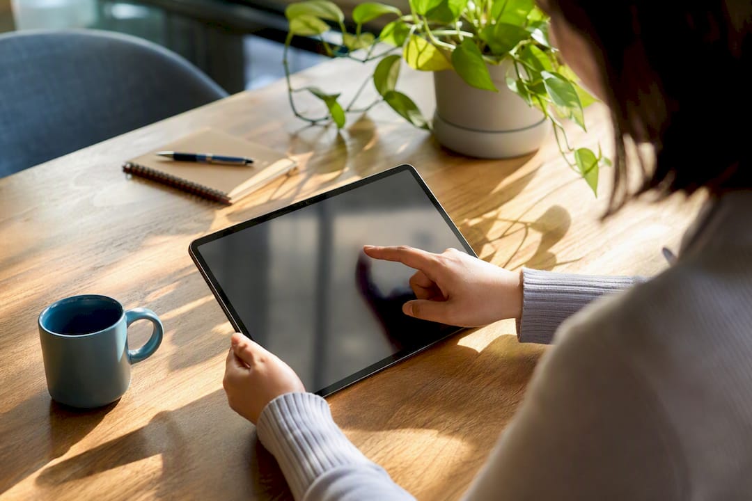 Hands adjusting data filters on touchscreen