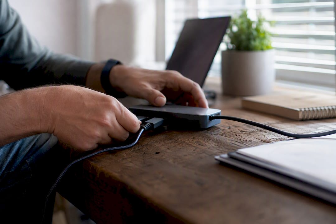 Hands connecting integration cable