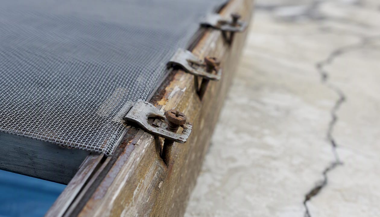 Rusty pool screen fasteners on aluminum frame