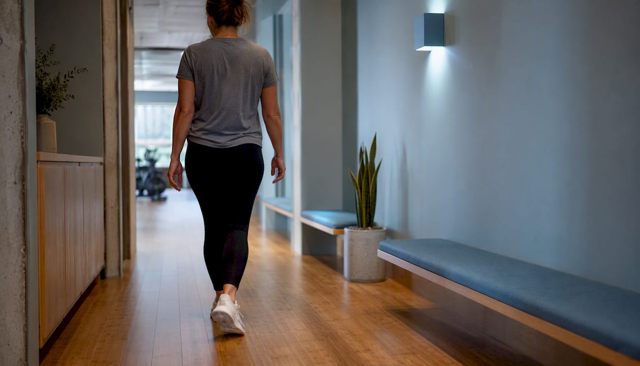 Person taking a brief mindful walk indoors