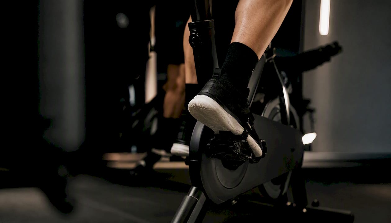 Close-up of legs pedaling with rhythmic cadence