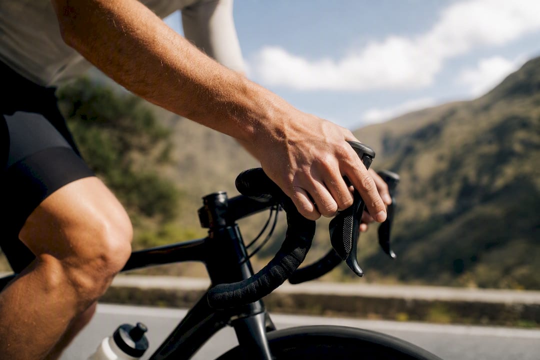 Close-up of cyclist hands shifting gears