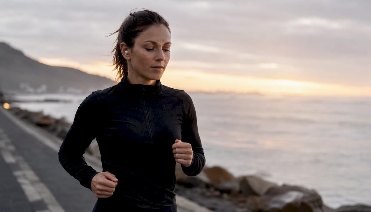 Runner practicing mindful breathing while moving