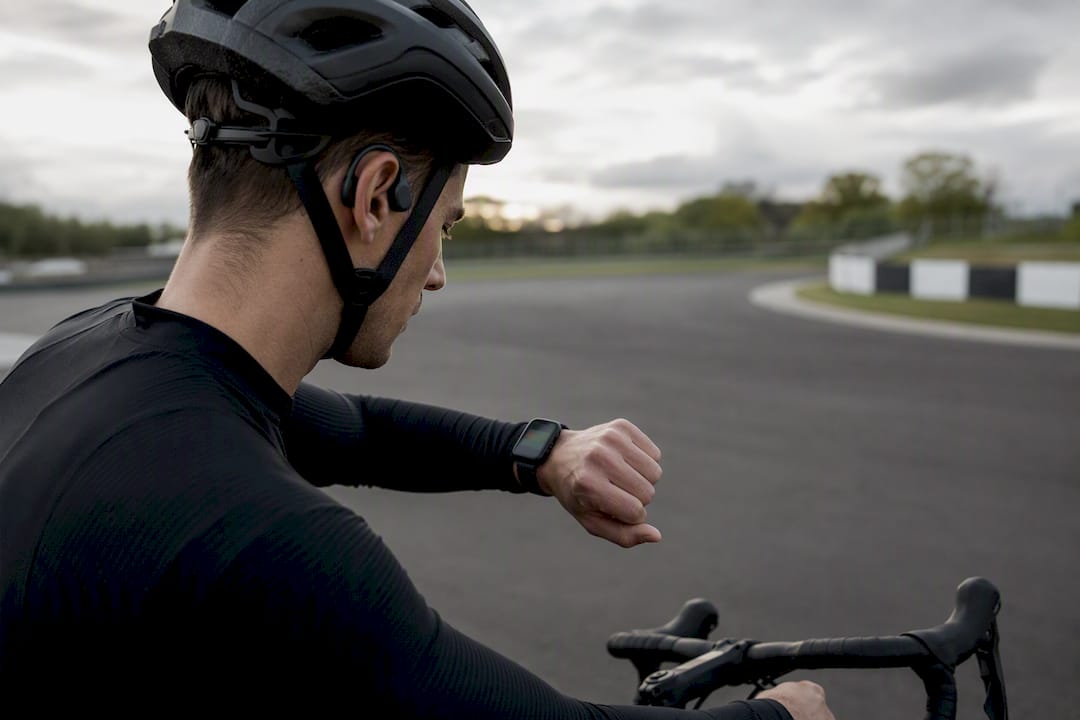 Cyclist checking wearable before interval