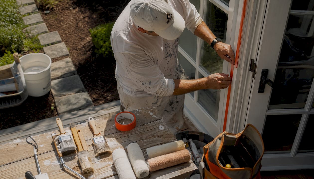Contractor prepping house for exterior painting