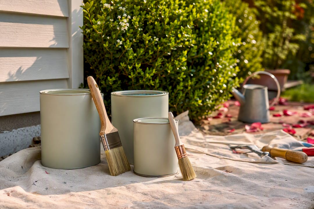 Eco-friendly paint cans and brushes outdoors