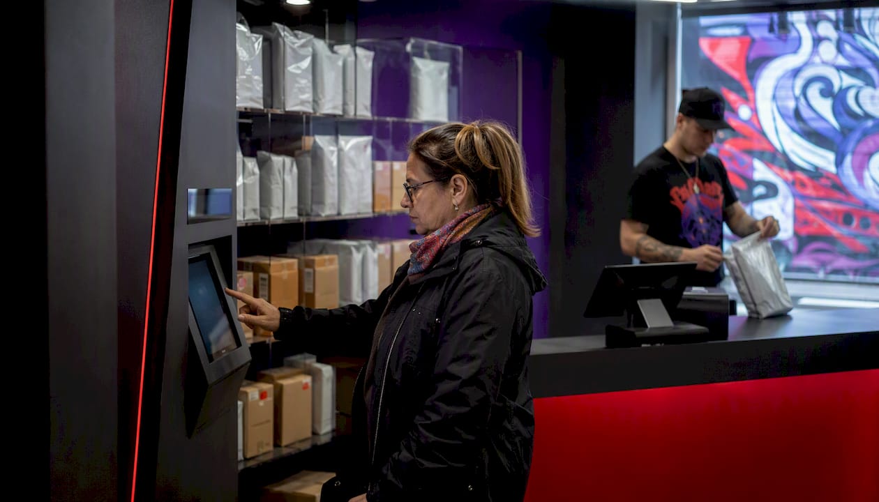 Customer using kiosk for express in-store pickup