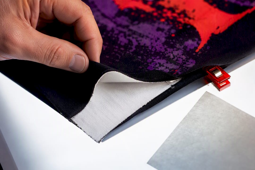 White underbase beneath dark fabric print