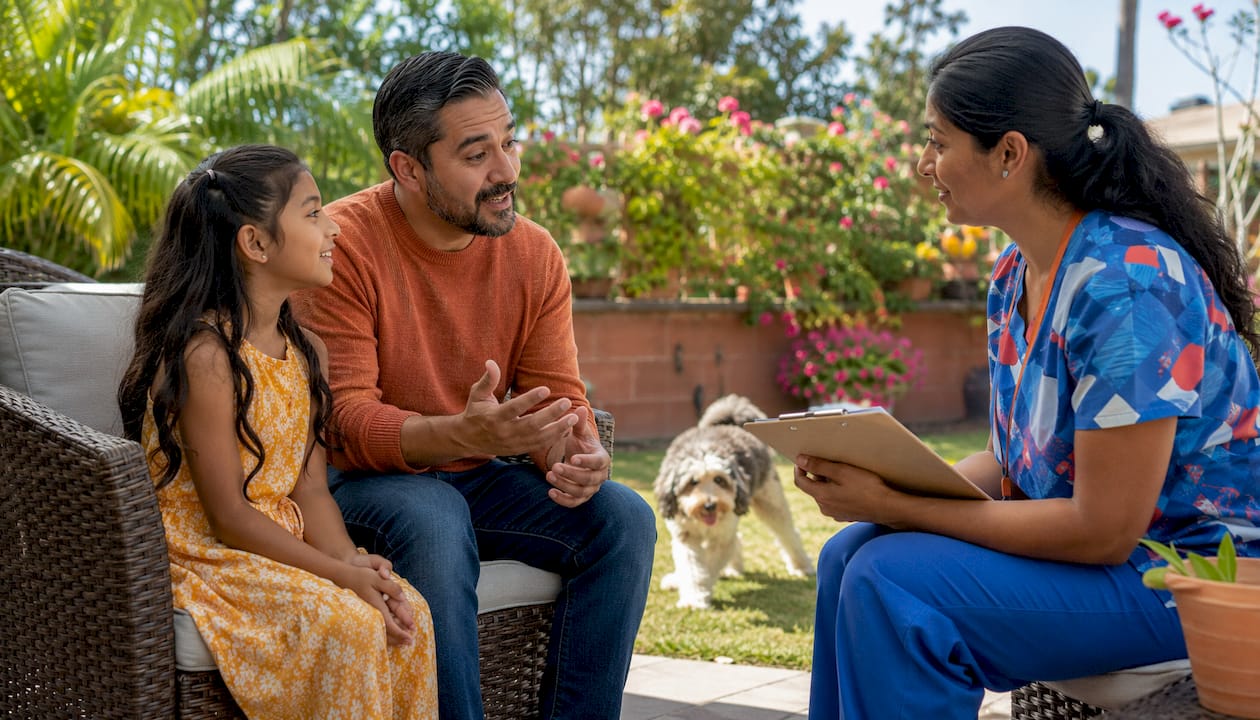 Family and pediatric nurse discussing care plan