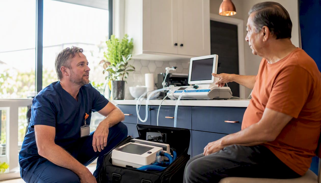 Nurse conducting intake assessment in family living room