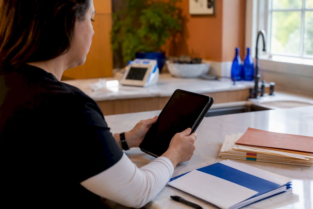 Caregiver hands preparing appeal documents