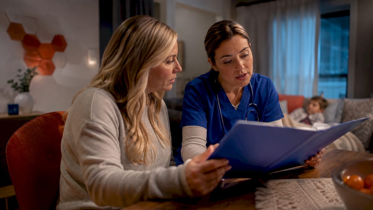 Parent and nurse reviewing home care paperwork