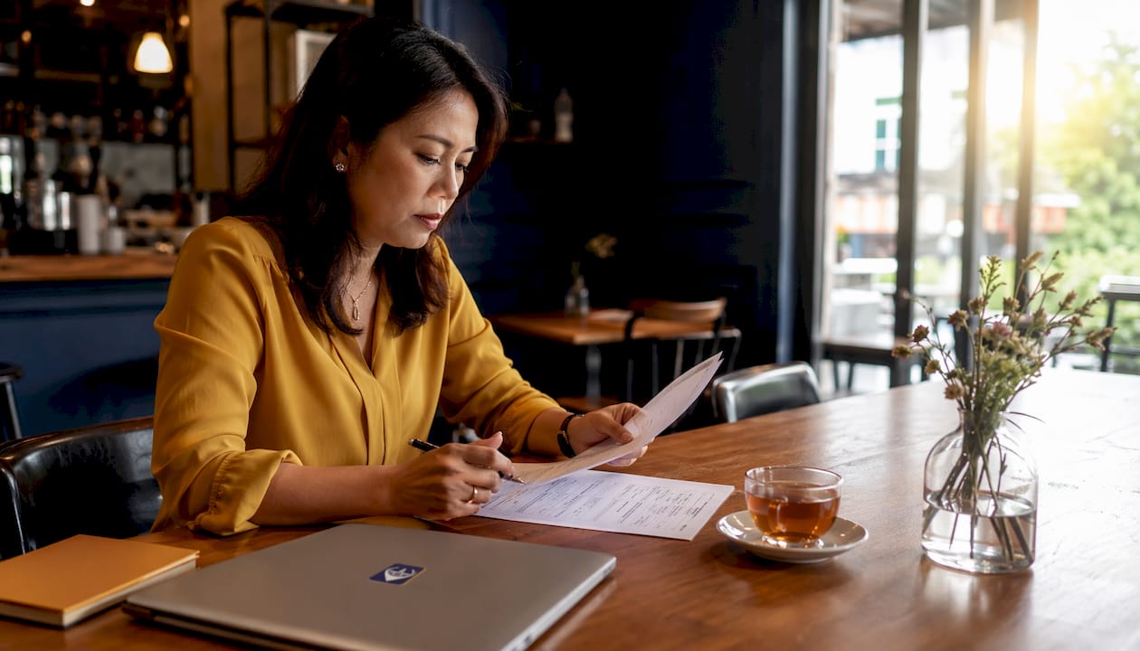 Tax consultant reviewing Singapore tax documents