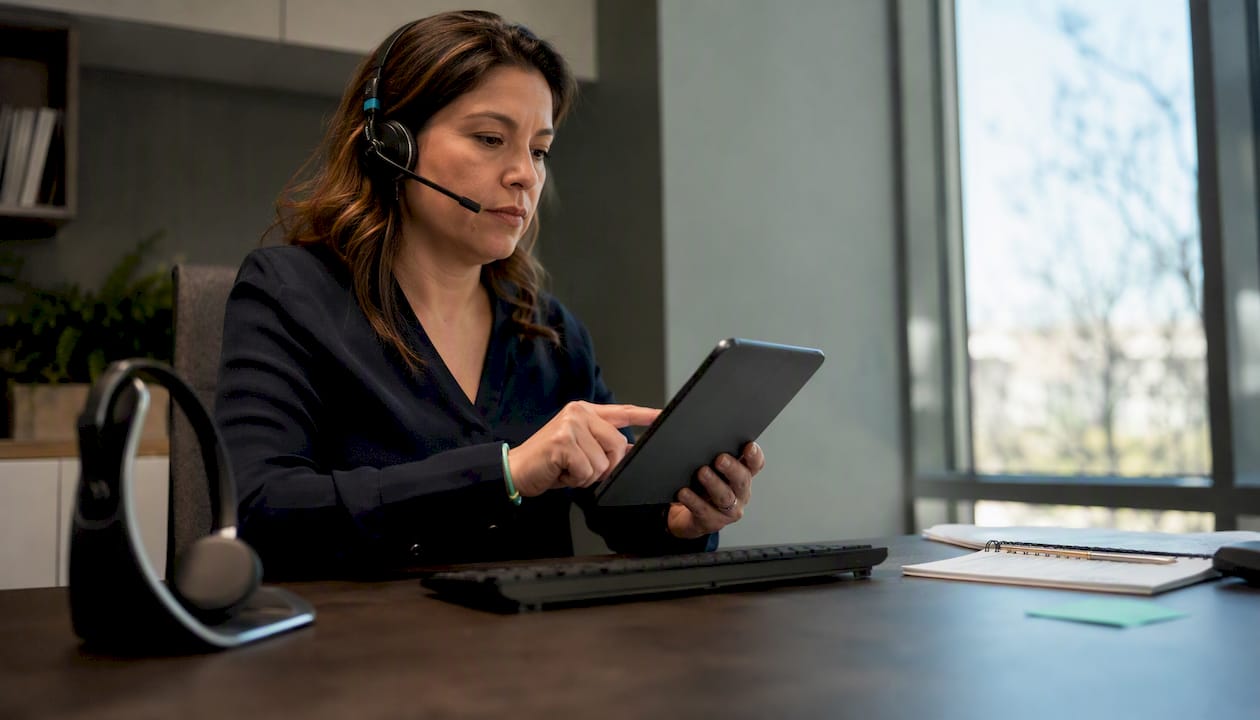 Customer support agent verifying RTP tiers on tablet