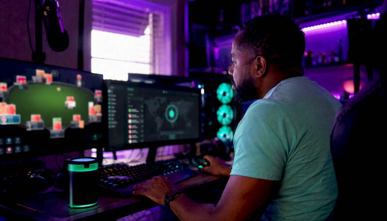 Man adjusting VPN for low latency gaming