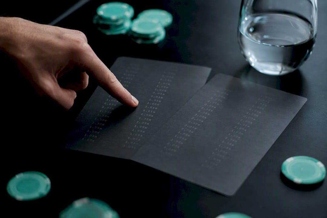 Hand pointing at repeated bet result data