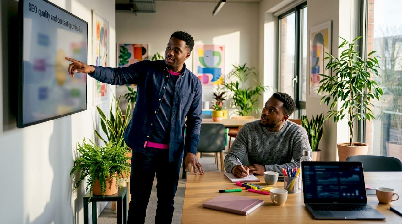 Two marketers discussing SEO and content quality