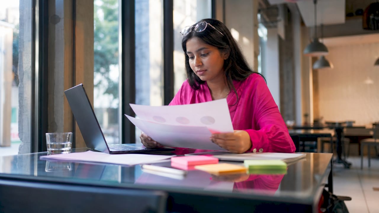 Woman organizing content optimisation materials