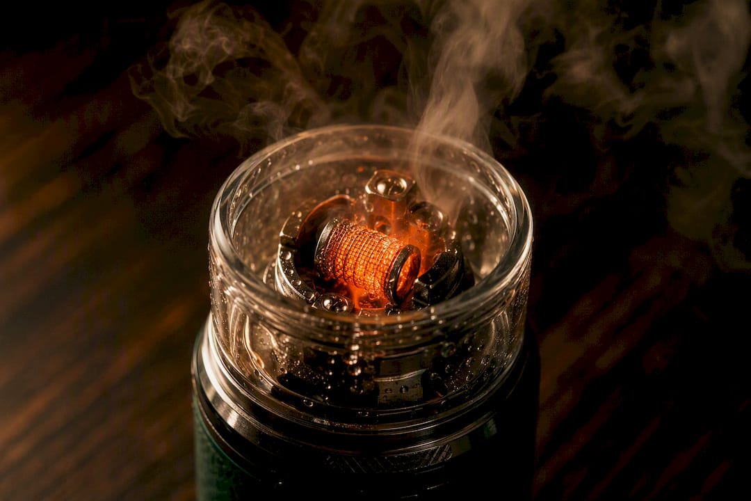 Vape coil with vaporizing e-liquid