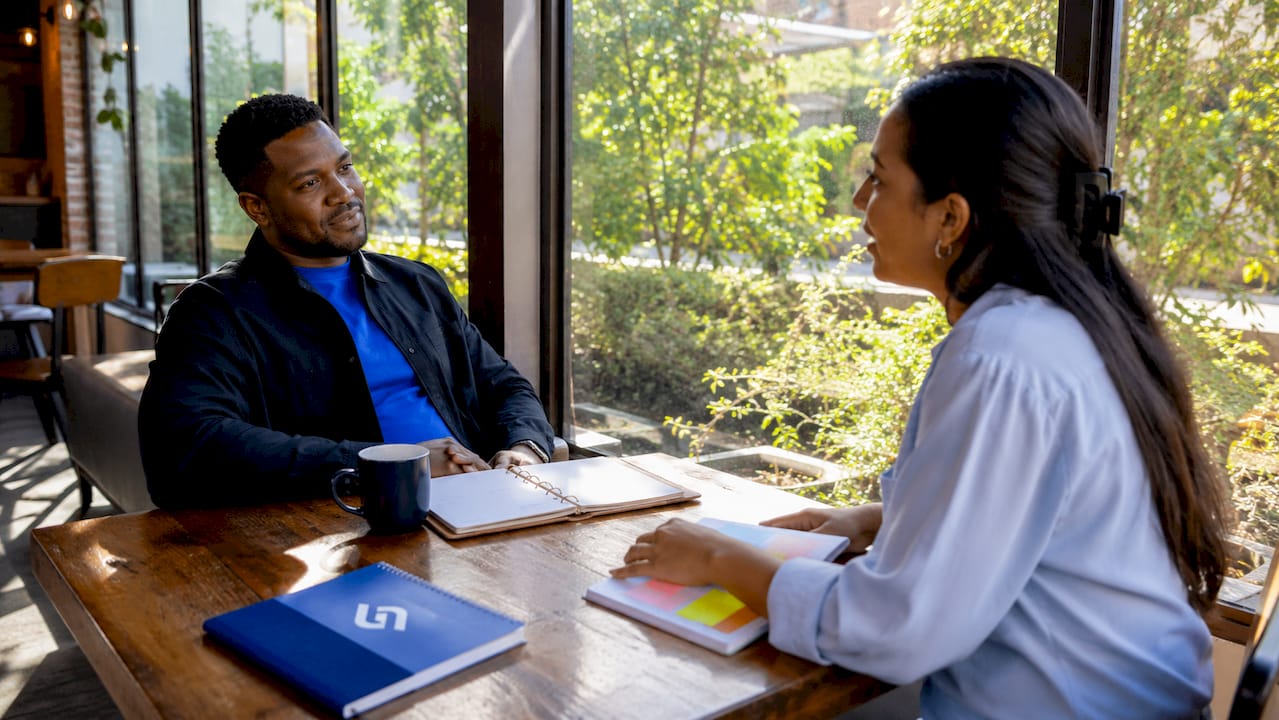 Manager and employee in one-on-one meeting