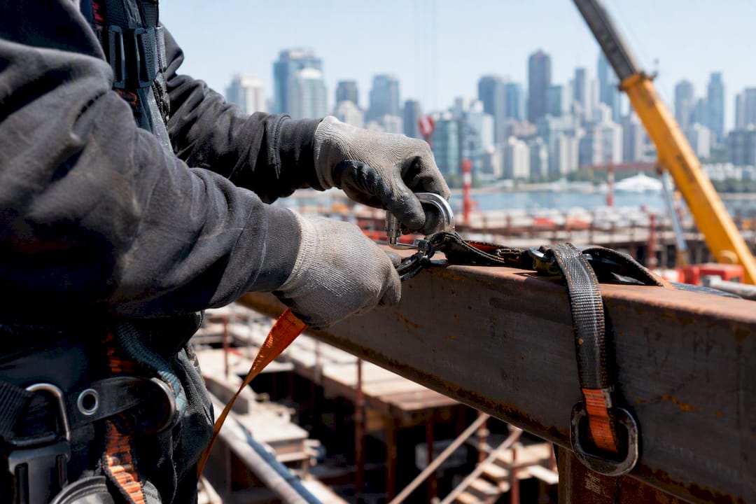 Worker installing guardrail safety control