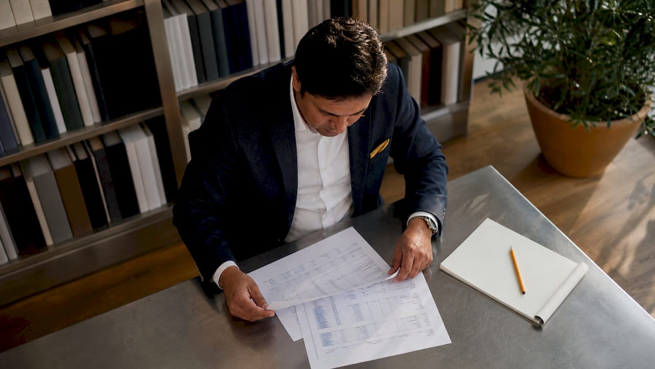 Businessman reviewing exit planning documents