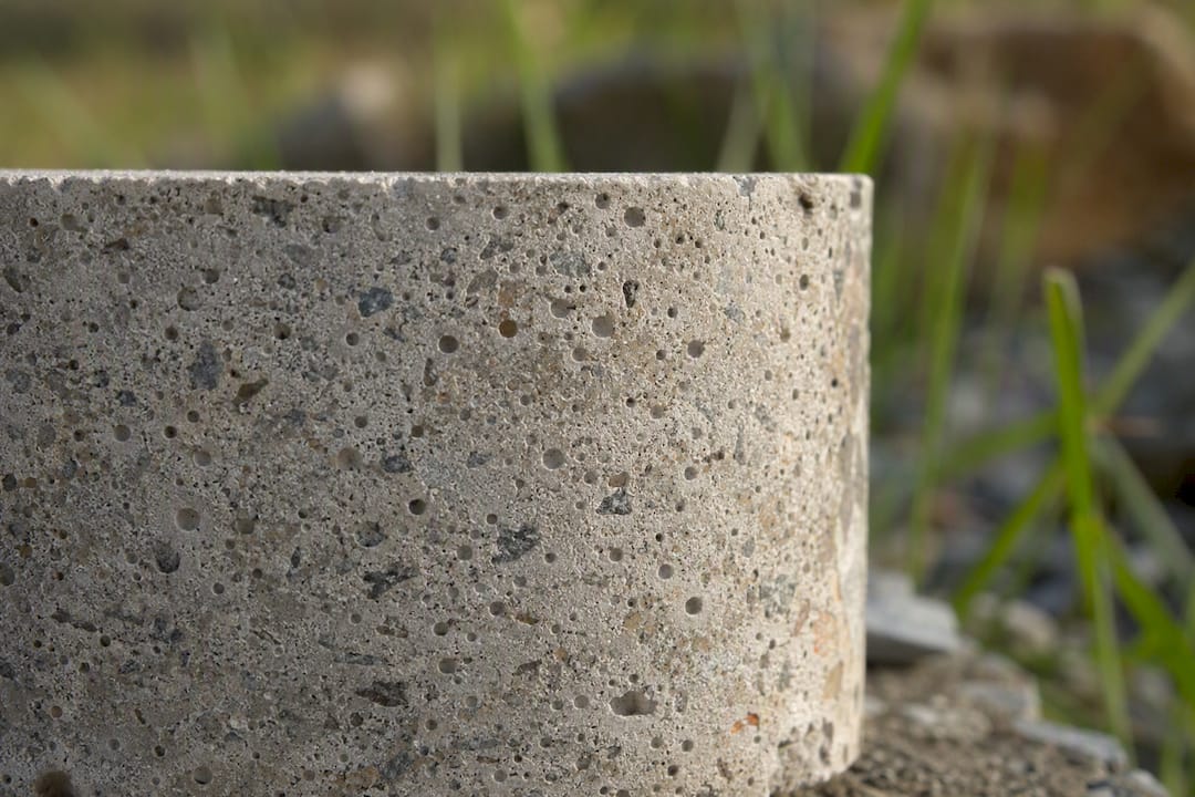 Microscopic air bubbles inside concrete close-up