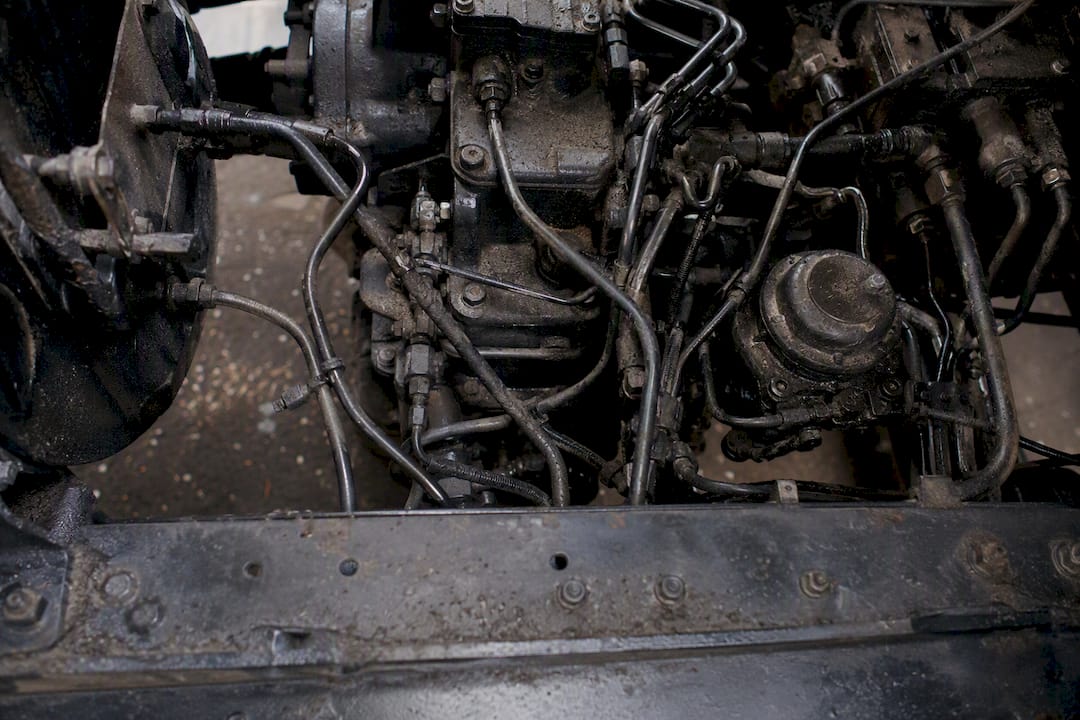 Grease and oil film on truck engine components