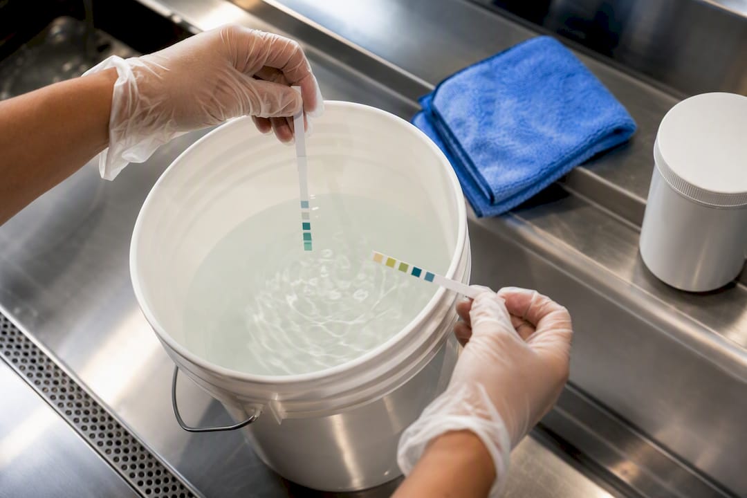 Hands testing sanitizer concentration