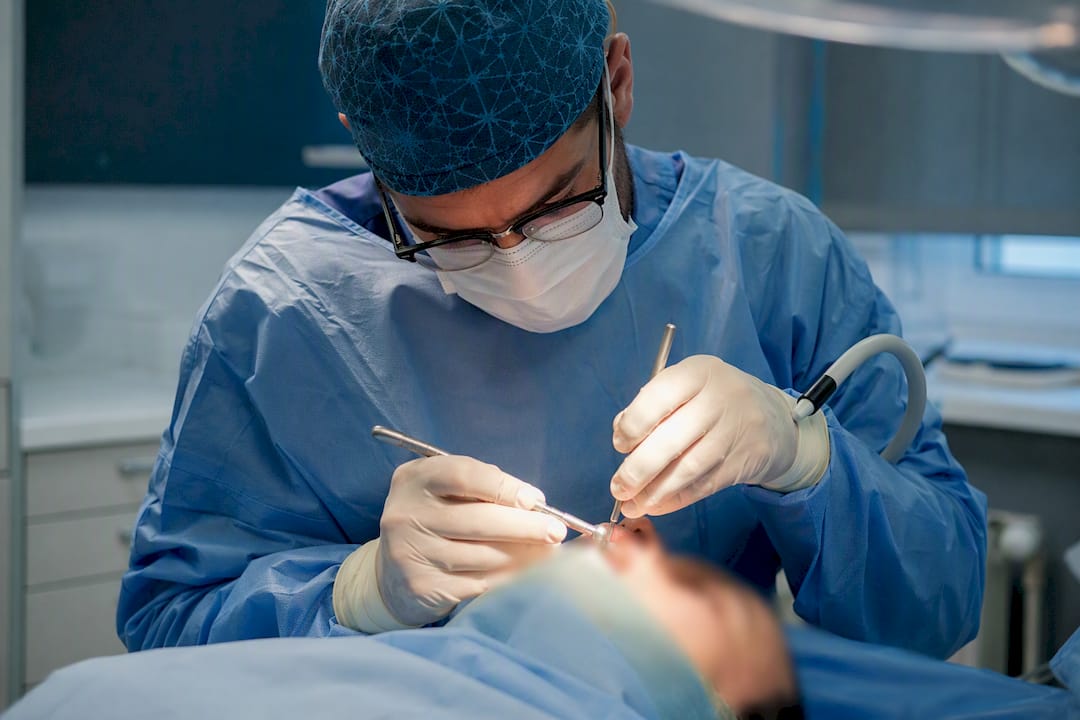 Oral surgeon performing sinus lift graft