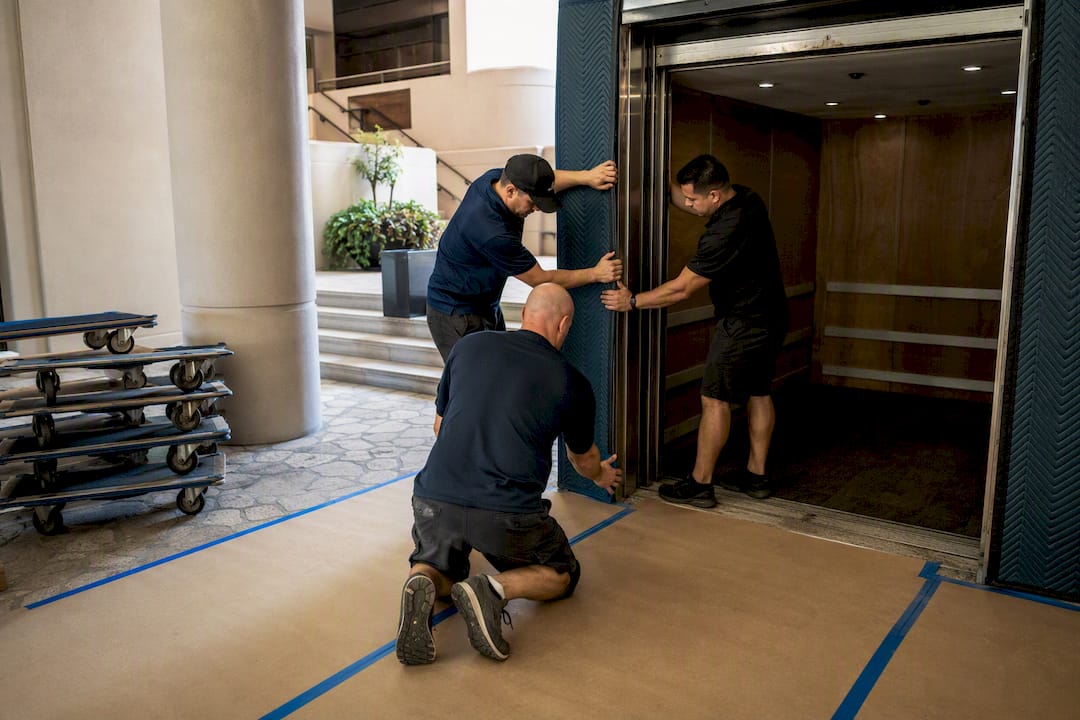 Condo freight elevator loading dock open with movers