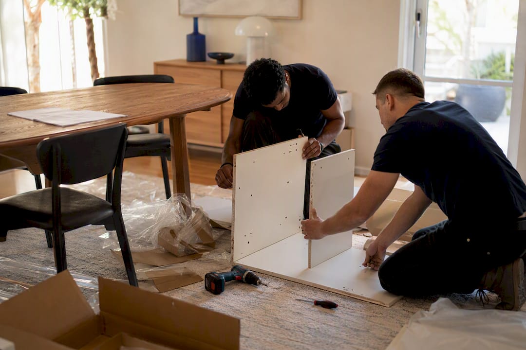 Hands assembling furniture during delivery day