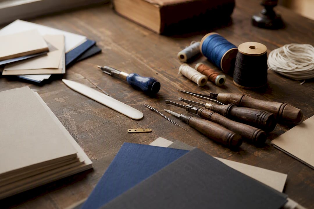 Bookbinding tools and typography samples