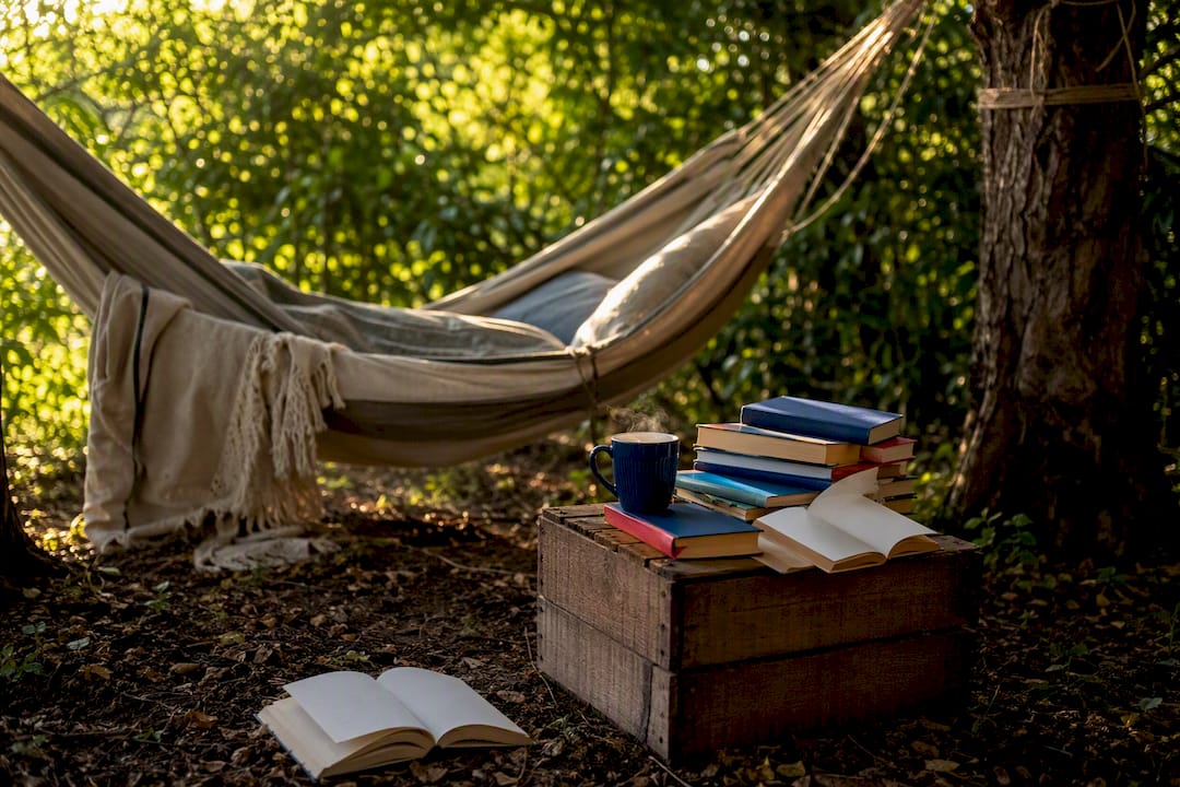 Stack of books about books on a wooden table