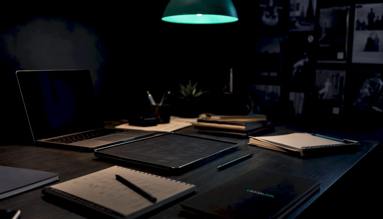Close-up dark workspace with tablet and design tools