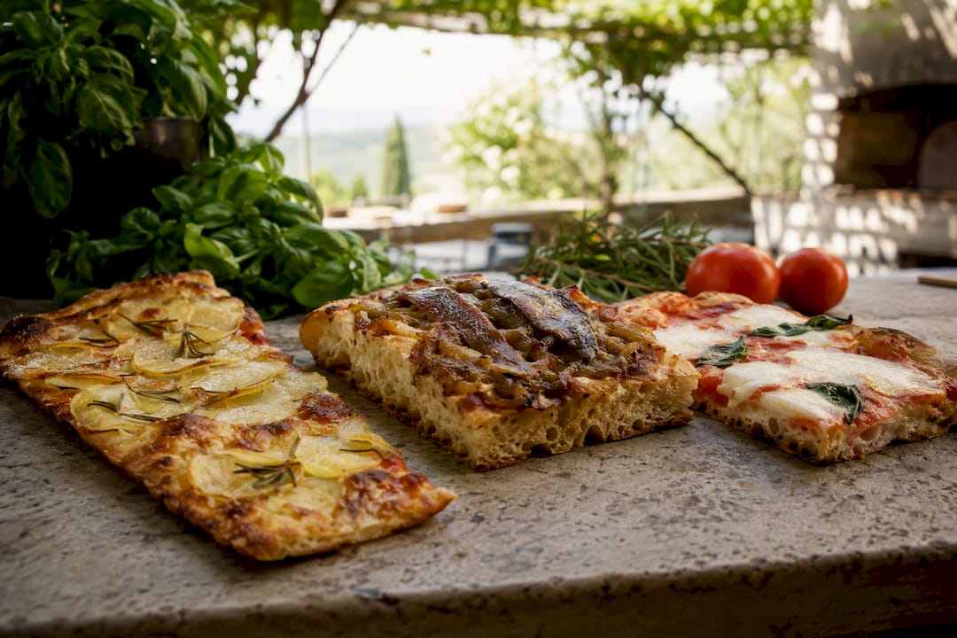 Three regional Italian artisan pizza slices