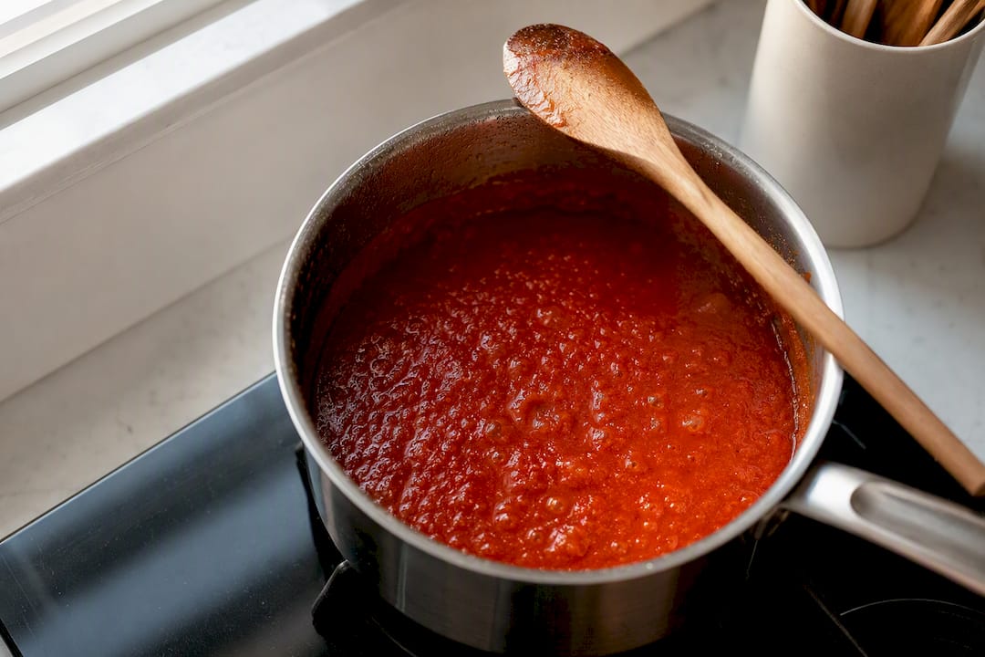 Tomato pizza sauce gently simmering