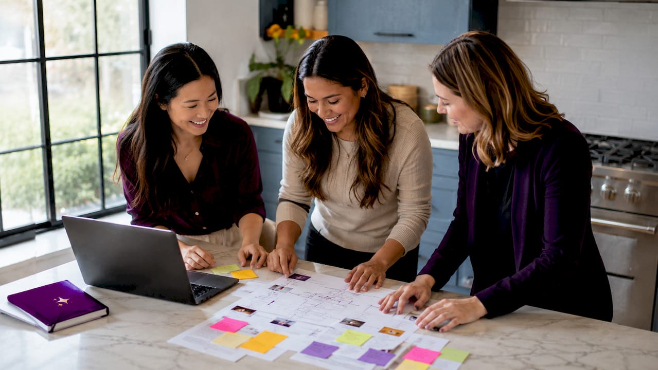 Group of female entrepreneurs collaborating at table