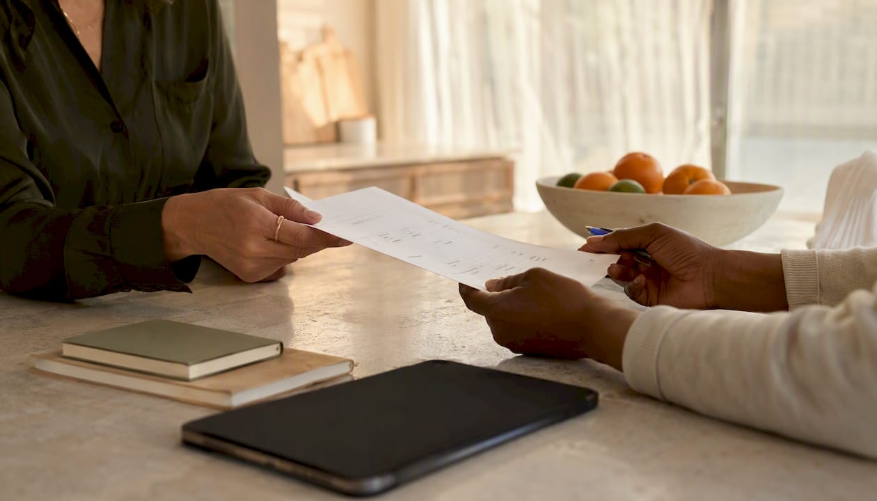 Hands exchanging custody evaluation payment invoice