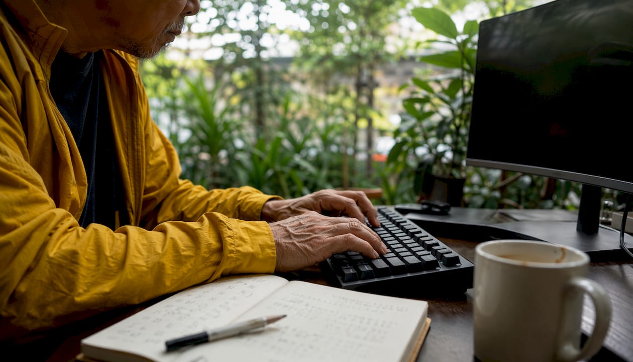 Engineer typing algorithm notes in home office