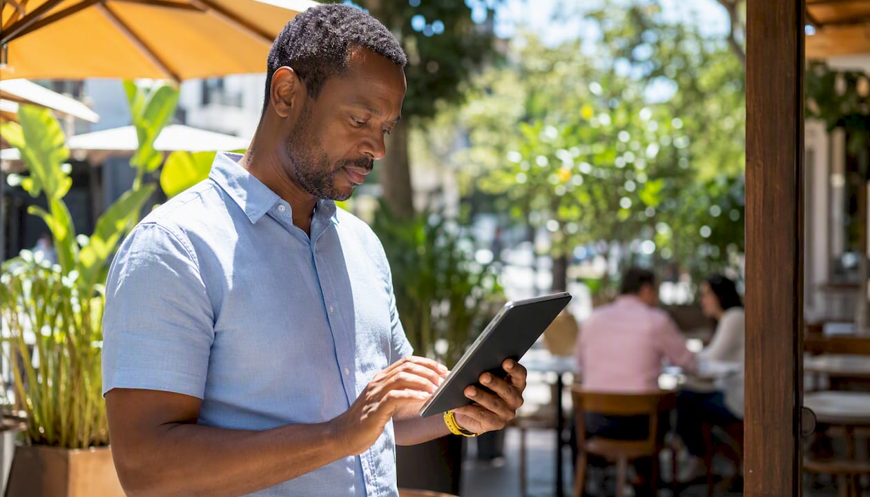 Data analyst reviewing verification metrics on tablet