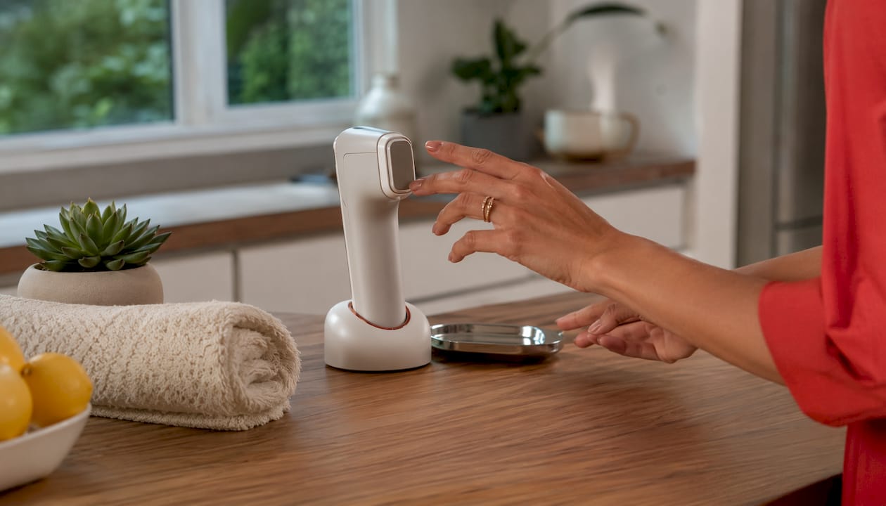 At-home collagen firming device on bathroom counter