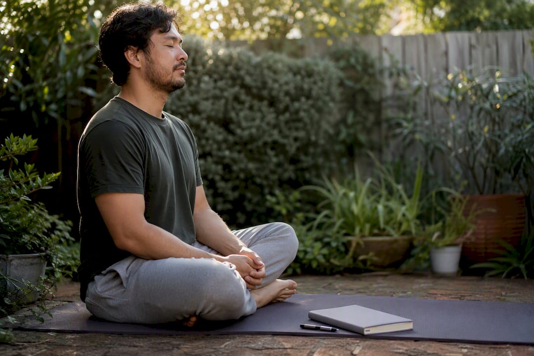 Man's hands resting during self-compassion practice