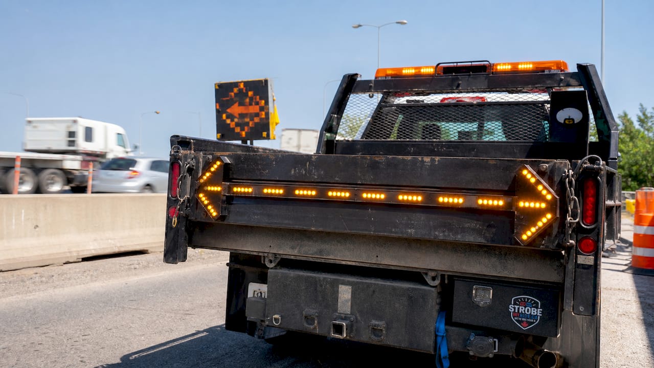Full-size amber traffic advisor light bar on tow truck