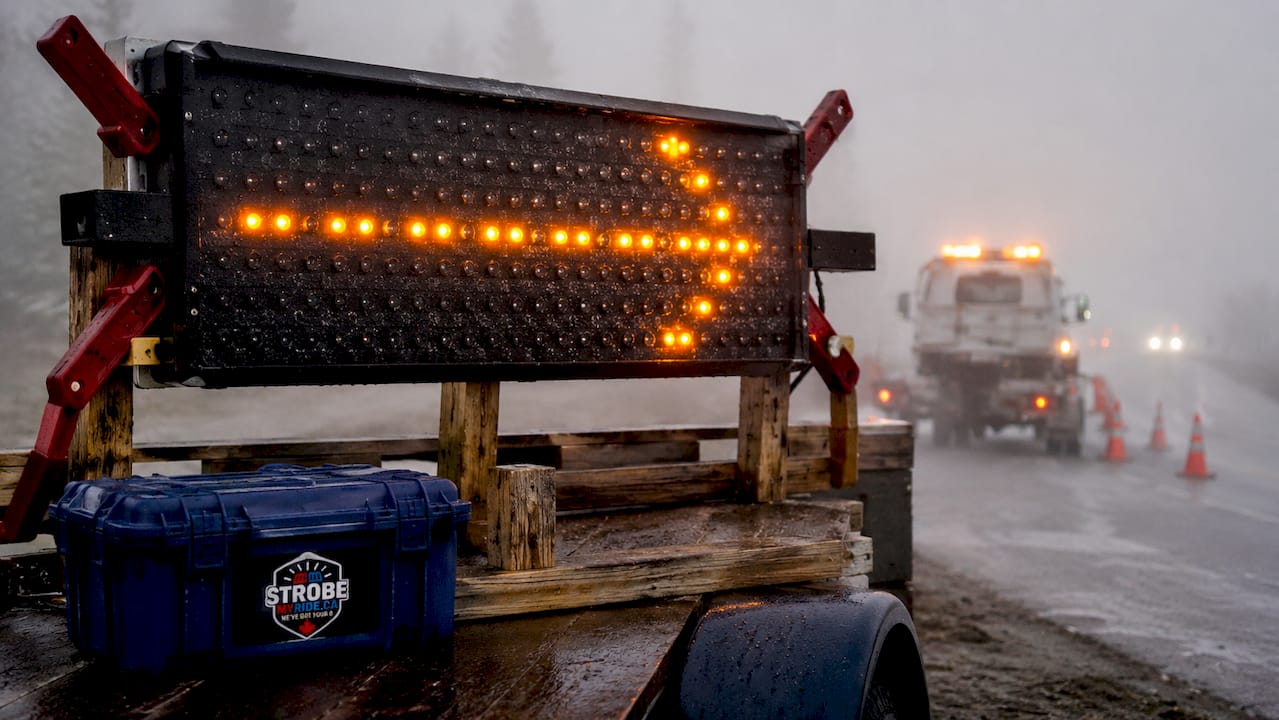 Close-up of sequential flashing amber LED arrow lights