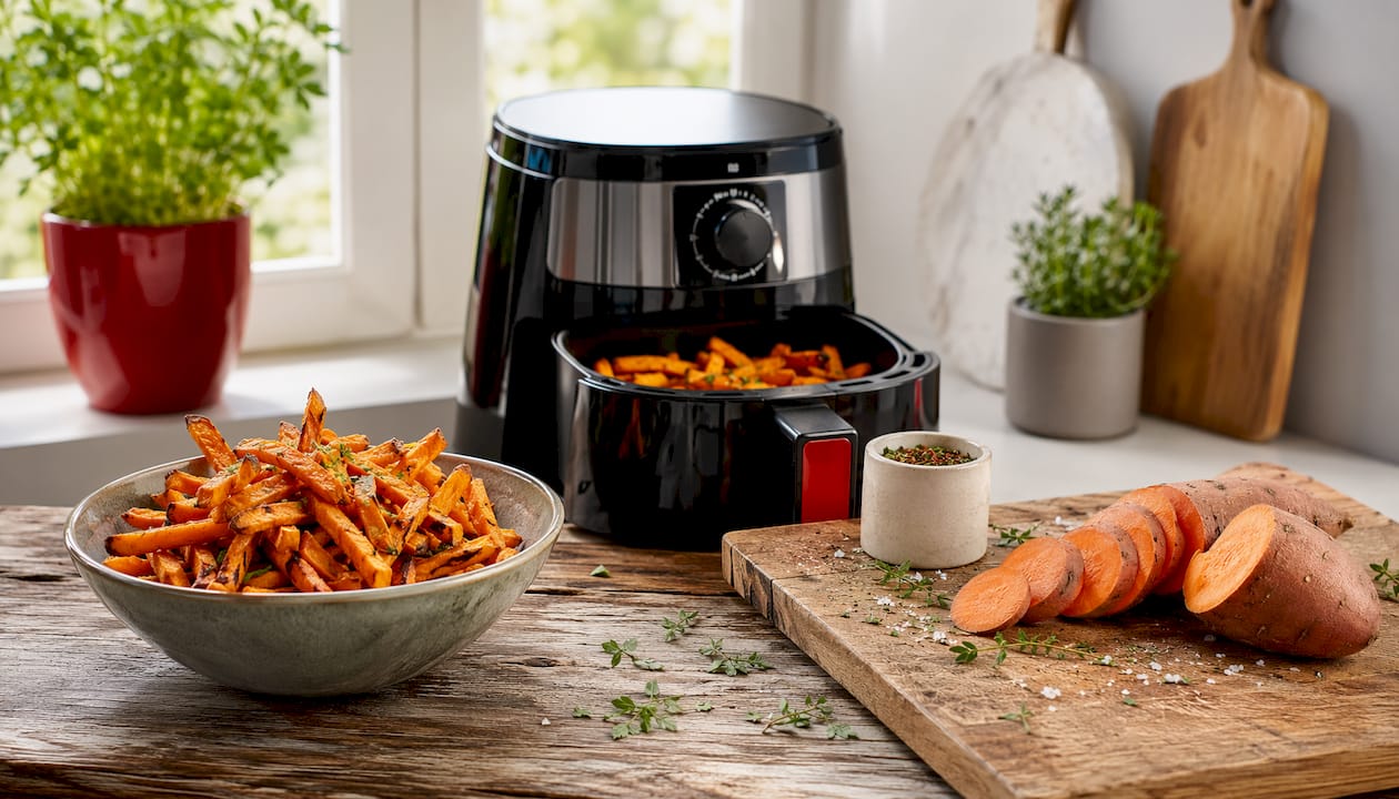 Plate of crispy sweet potato fries with air fryer