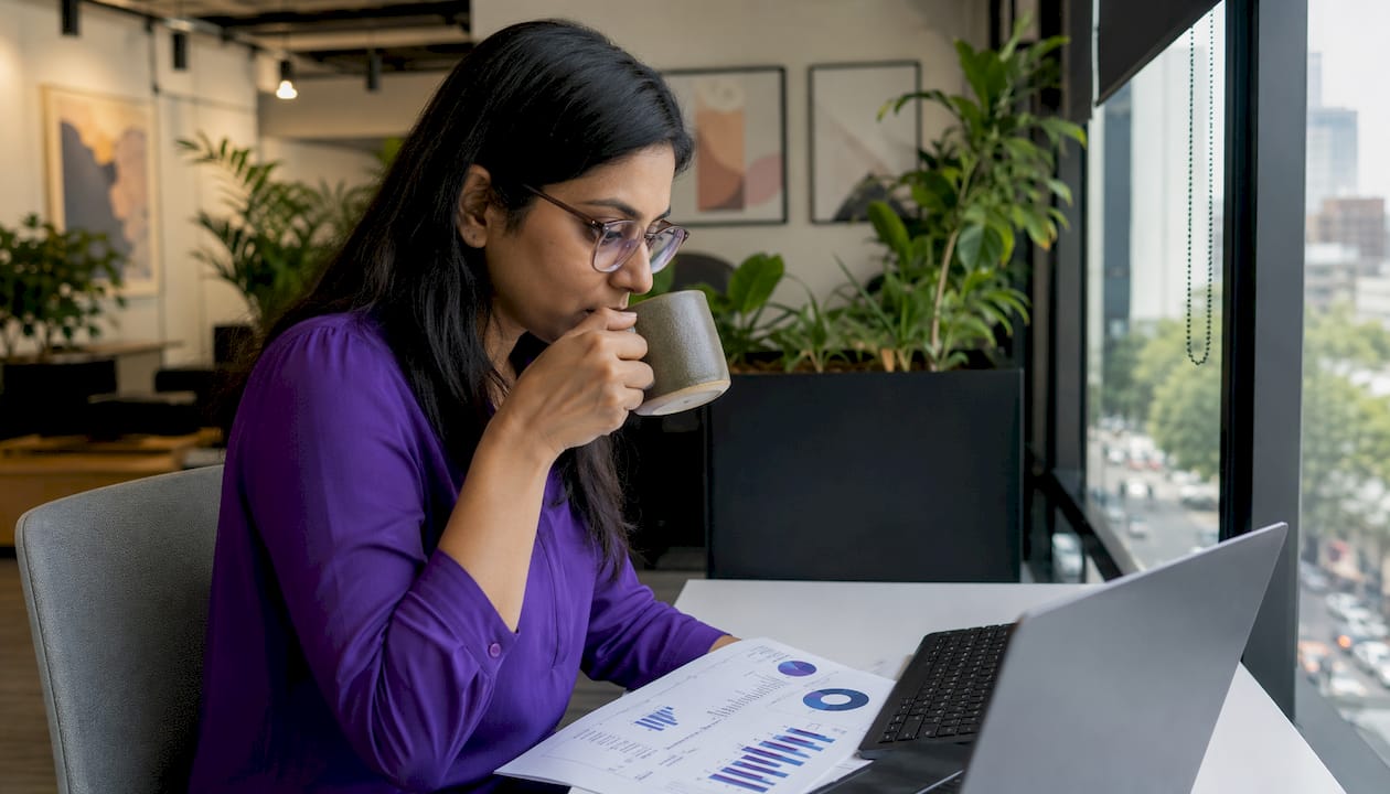 Engineer reflecting on location impact on pay in office