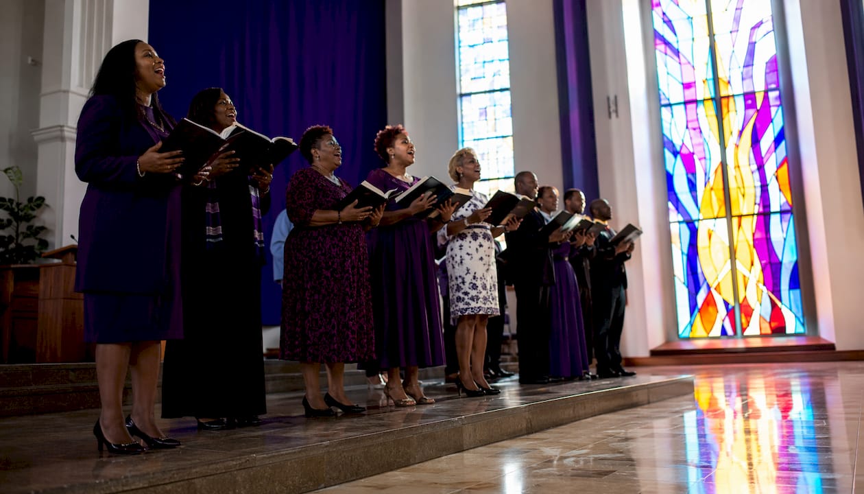 Choir singing hallelujah in church sanctuary