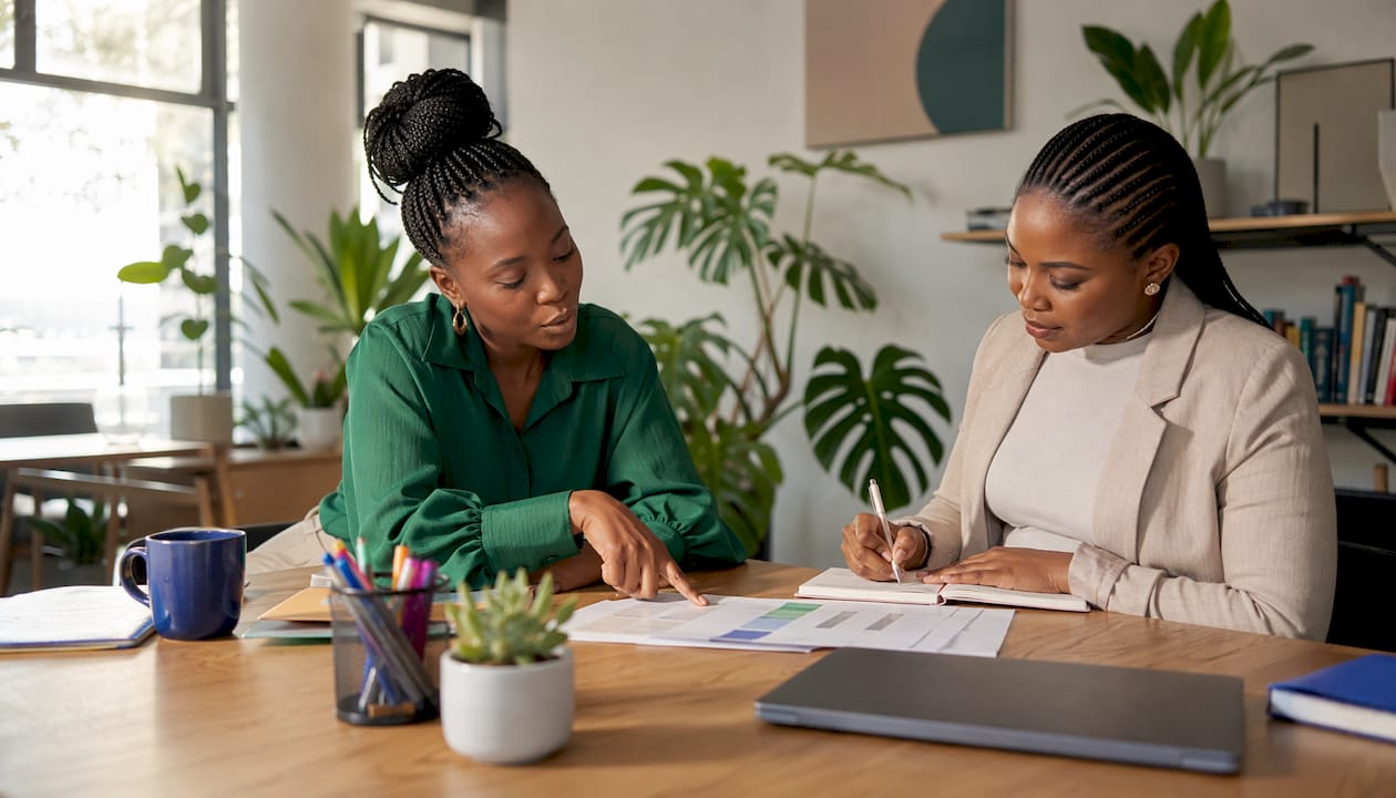 Two businesswomen preparing automation tender bids