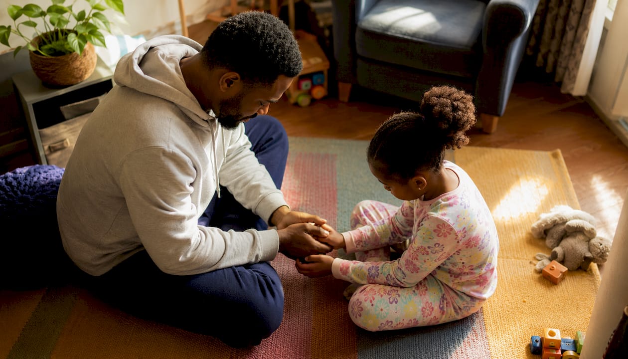 Father and daughter praying together